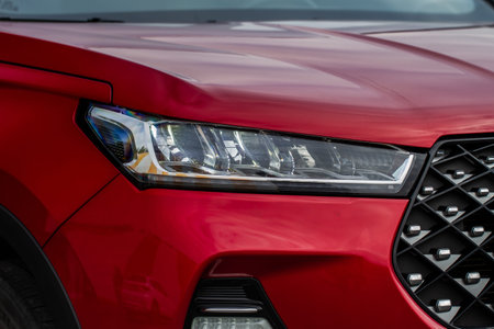Headlight lamp of new cars. Close up detail on one of the LED headlights modern car. Exterior...