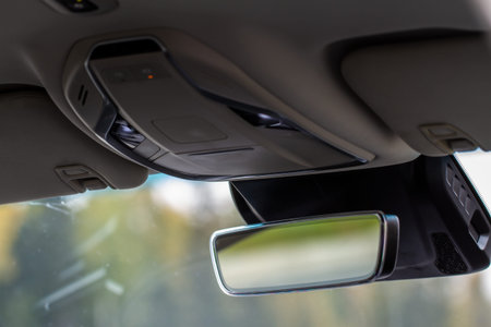 The rear view mirror inside the car.