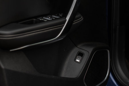 Car trunk open button. Electric trunk switch controller. Car trunk electric lock button on the door.