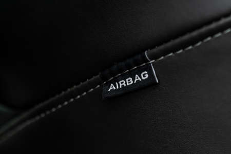 Close up view of airbag label on the side of a car seat. Airbag safety system symbol on the car seat. Modern car interior details.の写真素材