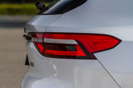 Modern rear light of a car. Brake light and arrow of large suv. Rear light of car close up view. Tail light.の写真素材
