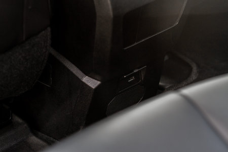 Opened car USB port in the car for connecting device. Power output of usb charger close up view. Car...