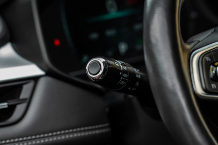 Light switch control. Close up of car light switch and control. Modern car interior detail.