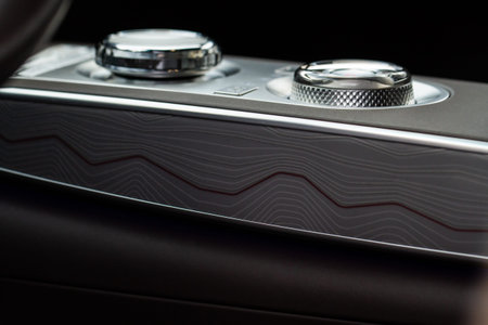 Modern car interior close up view with metallic and plastic details. Interior detail.