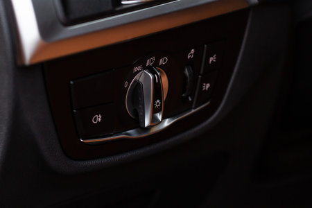 Closeup of the headlight switch control button. light control panel in car