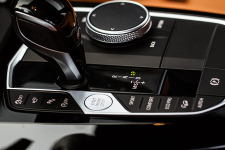 Modern car automatic gearbox. Gearbox control buttons. Gear selector close up.