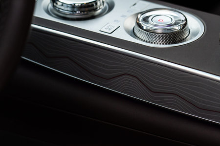 Modern car interior close up view with metallic and plastic details. Interior detail.