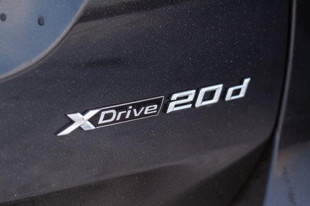 MOSCOW, RUSSIA - FEBRUARY 05, 2022 BMW XDrive all-wheel drive system badge on the car. car body close up view. BMW XDrive logo on the car trunk door.のeditorial素材