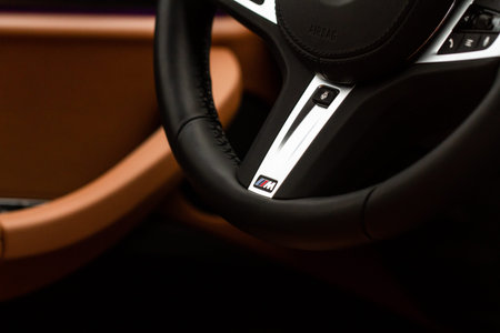 MOSCOW, RUSSIA - FEBRUARY 05, 2022 BMW M Power logo on the BMW X3 steering wheel. Steering wheel...