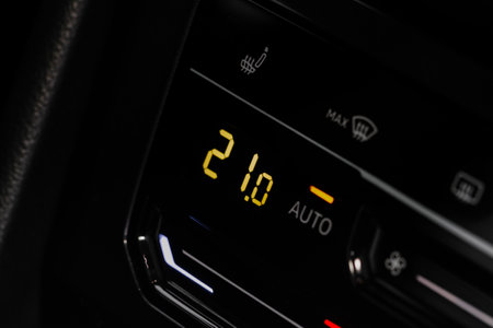 Digital control panel car air conditioner dashboard. Modern car interior conditioning buttons inside a car close up view.の写真素材