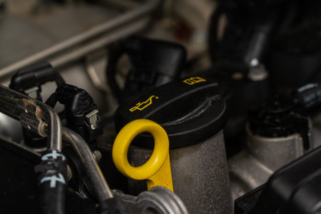 Closeup oil cap in engine room of a modern car. Oil cap on the car engine. engine oil inspection....