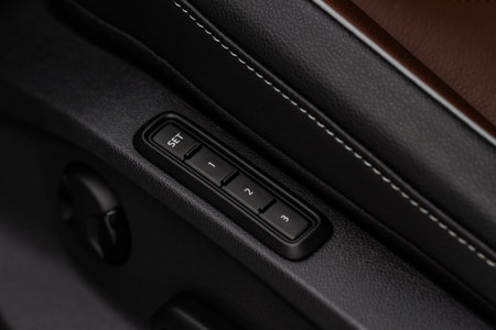 Electric car seat adjustment control panel close up view. Adjustable car seat position. Car...