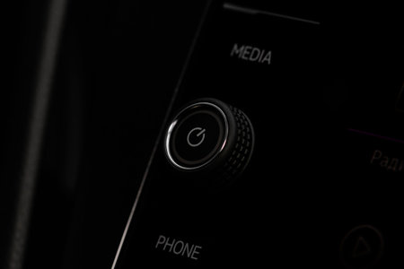 Car media buttons dashboard. Detail of a modern car controller.