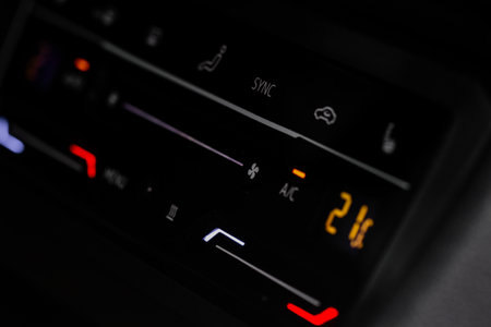Digital control panel car air conditioner dashboard. Modern car interior conditioning buttons inside a car close up view.の写真素材