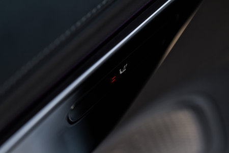 Seat heating controller buttons close up view. car interior. Seat heater button, car interior. The...