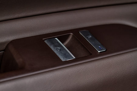Interior doors of the car. Car door panel with buttons for lock car and lower windows.