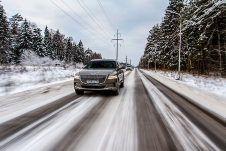 MOSCOW, RUSSIA - DECEMBER 04, 2021 Genesis GV80 (JX1), a modern sedan car. Genesis GV80 in motion view. Genesis JX1のeditorial素材