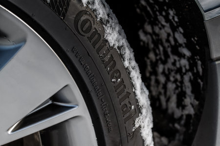 MOSCOW, RUSSIA - DECEMBER 04, 2021 Continental tire logo on the sidewall of the new tire. The detail of a brand new Continental tire.のeditorial素材