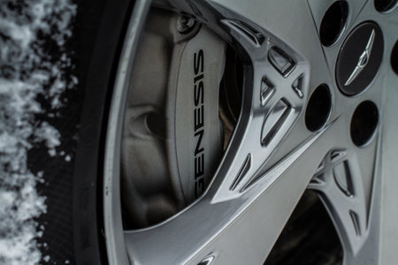 MOSCOW, RUSSIA - DECEMBER 04, 2021 Genesis GV80 (JX1) brakes calipers close up. Modern Genesis car braking system. Closeup steel brake disc.のeditorial素材