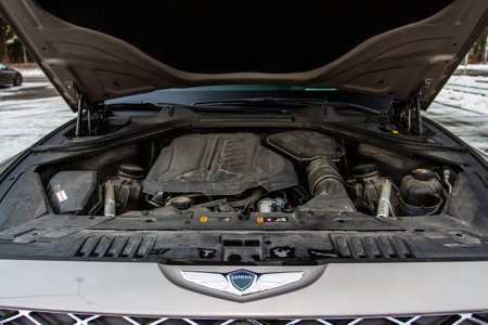MOSCOW, RUSSIA - DECEMBER 04, 2021 Genesis GV80 (JX1) engine. SUV car with open hood. car engine. Car engine and parts under hood bonnetのeditorial素材