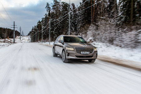 MOSCOW, RUSSIA - DECEMBER 04, 2021 Genesis GV80 (JX1), a modern sedan car. Genesis GV80 in motion view. Genesis JX1のeditorial素材