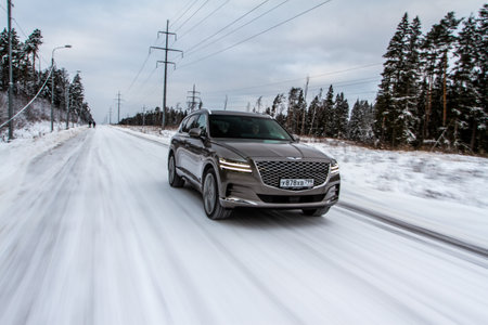 MOSCOW, RUSSIA - DECEMBER 04, 2021 Genesis GV80 (JX1), a modern sedan car. Genesis GV80 in motion view. Genesis JX1のeditorial素材