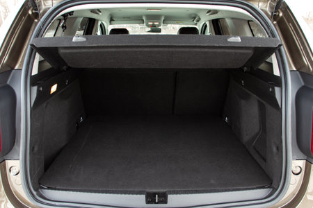 Huge, clean and empty car trunk in interior of compact suv. Rear view of a SUV car with open trunkの写真素材