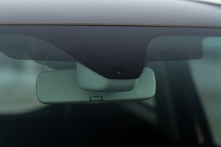 Rain and light sensor on the windshield of the car. Modern car safety feature.の写真素材