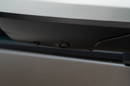 Close up view of surround view camera system on modern car side rear mirror. Blind spot and parking assistant camera. Parking assistance camera.の写真素材
