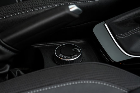 drive selector button. Car interior, offroad drive controller closeup view. Wheel drive selection. Four-Wheel Drive transmission selection system.の写真素材