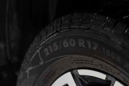 Close up view of tire with tire width, height and wheel diameter designation. Tire size types labels.の写真素材