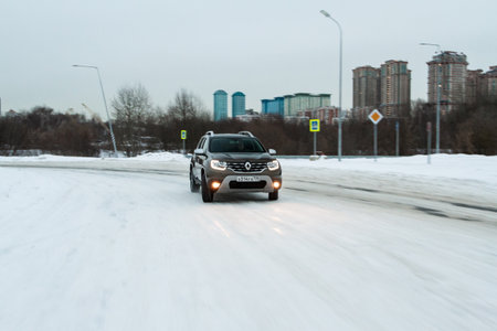 MOSCOW, RUSSIA - JANUARY 09, 2022 Renault Duster (Second generation) exterior view in motion. Renault Duster in motion view. Modern SUV car.のeditorial素材