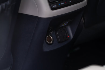 Modern car socket. Opened 12V power outlet socket and 220v power outlet socket in the car. open sockets.の写真素材