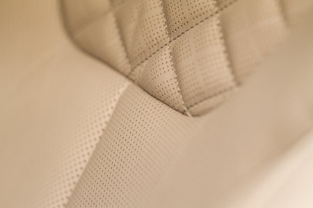 Part of leather car seat. macro. Car leather interior details. High angle view of modern car fabric seats.の写真素材