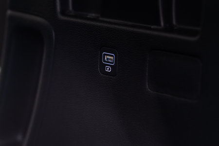 USB port in the car panel close up. Car interior detail. Car usb charger detail.の写真素材