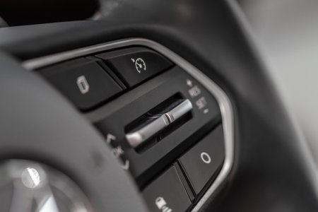 Cruise control switch closeup. Adaptive cruise control leaver. Cruise control on steering wheel.の写真素材