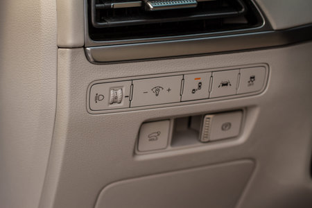 Close up view of modern car electronic safety systems control panel. Modern car interior detail.