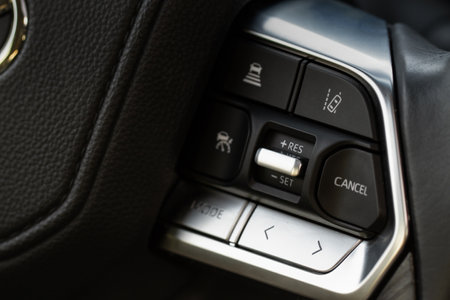 Cruise control switch closeup. Adaptive cruise control leaver. Cruise control on steering wheel.の写真素材