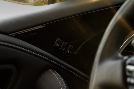 Electric car seat adjustment control panel close up view. Adjustable car seat position. Car...