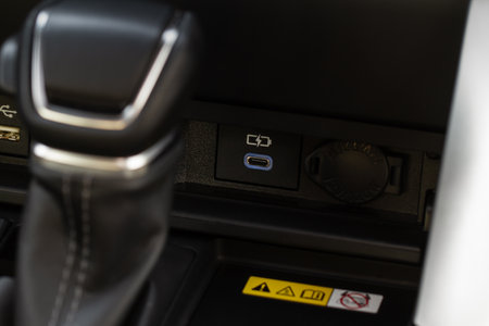 USB port in the car panel close up. Car interior detail. Car usb charger detail.の写真素材