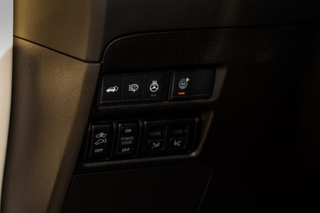 Car automatic high beam switch. Button to raise and lower the light beam.