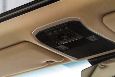 Close up image of the SOS button and car ceiling lamp in a car.の写真素材