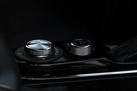 Car media buttons dashboard. Detail of a modern car controller.の素材 [FY310199964130]