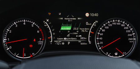 Modern digital car mileage. Car dashboard with sensors and information. RPM, Fuel indicator and temperature.Translation: "Fuel consumption. Hold OK to reset. After reset. Before reset "の写真素材