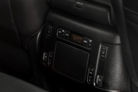 Digital control panel car air conditioner dashboard. Modern car interior conditioning buttons inside a car close up view.の写真素材