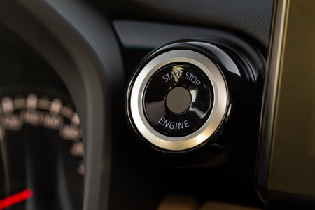 Engine start button with fingerpint close up. car start button.の写真素材