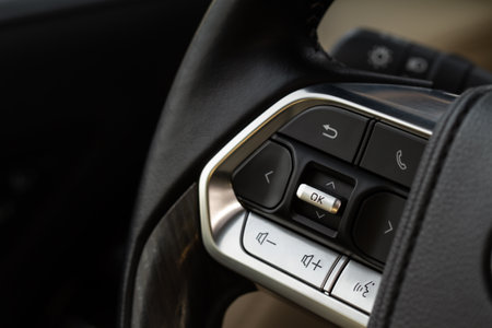 Call buttons on car steering wheel. Audio control buttons on the steering wheel of a modern car.の写真素材
