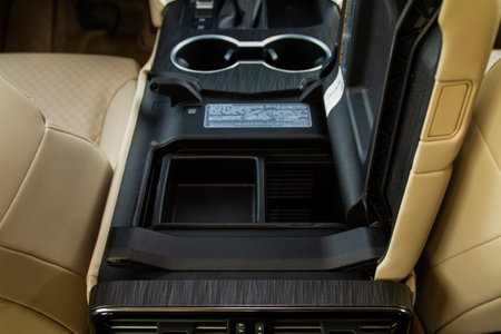 Car armrest opened. Opened armrest in the car for driver.の写真素材