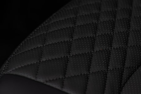 High angle view of modern car fabric seats. Close-up car seat texture and interior details. Detailed image of a car pleats stitch work.の写真素材