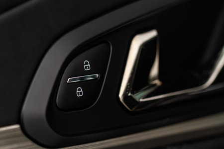 Car central door lock and unlock button close up. Close and open signs.の写真素材